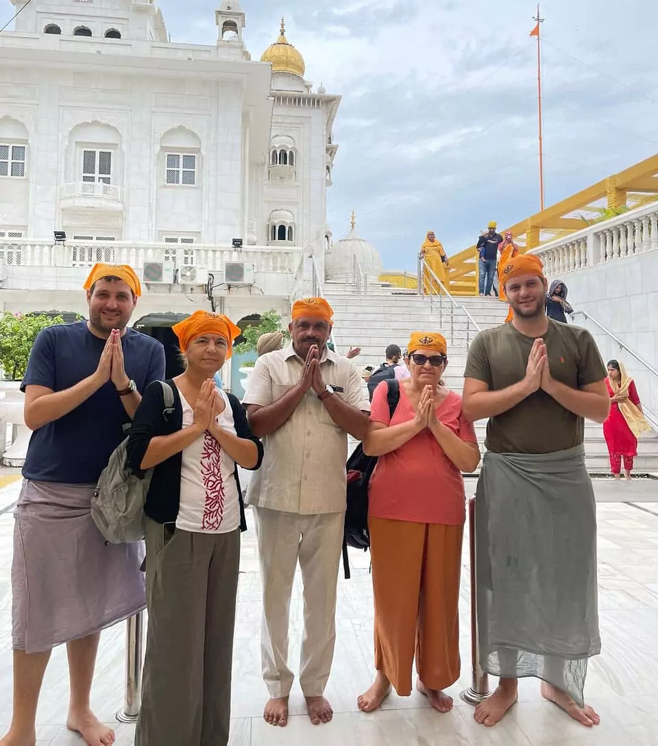 Namaste Private Driver India customers posing with Vinesh in temple